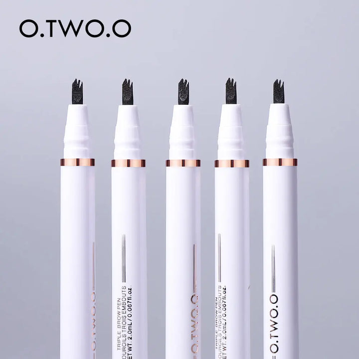 a group of four pens sitting next to each other
