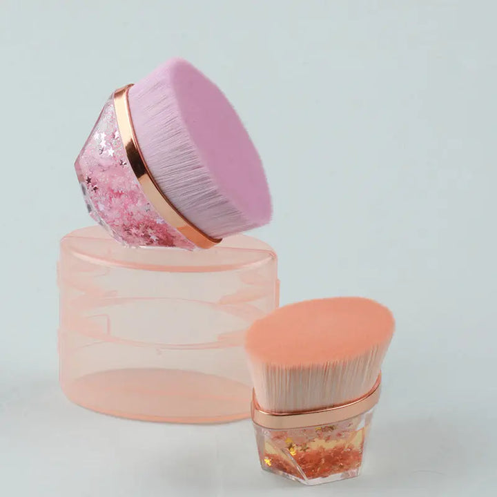 a pink brush and a pink container on a white surface